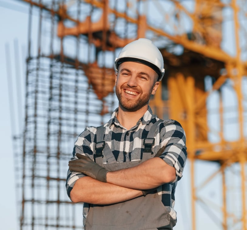 happy-worker-is-standing-on-the-construction-site-2023-01-19-04-17-50-utc